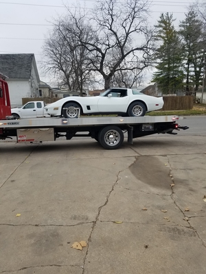 Car on flatbed truck